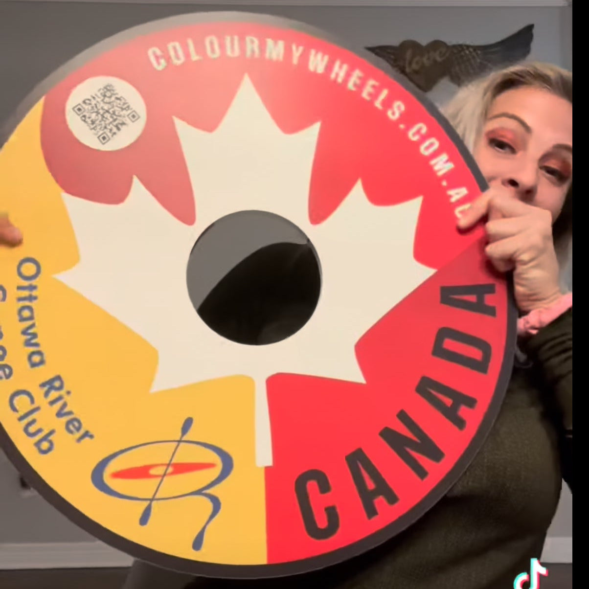 Brianna Hennessy shows off her Team Canada Wheel Covers